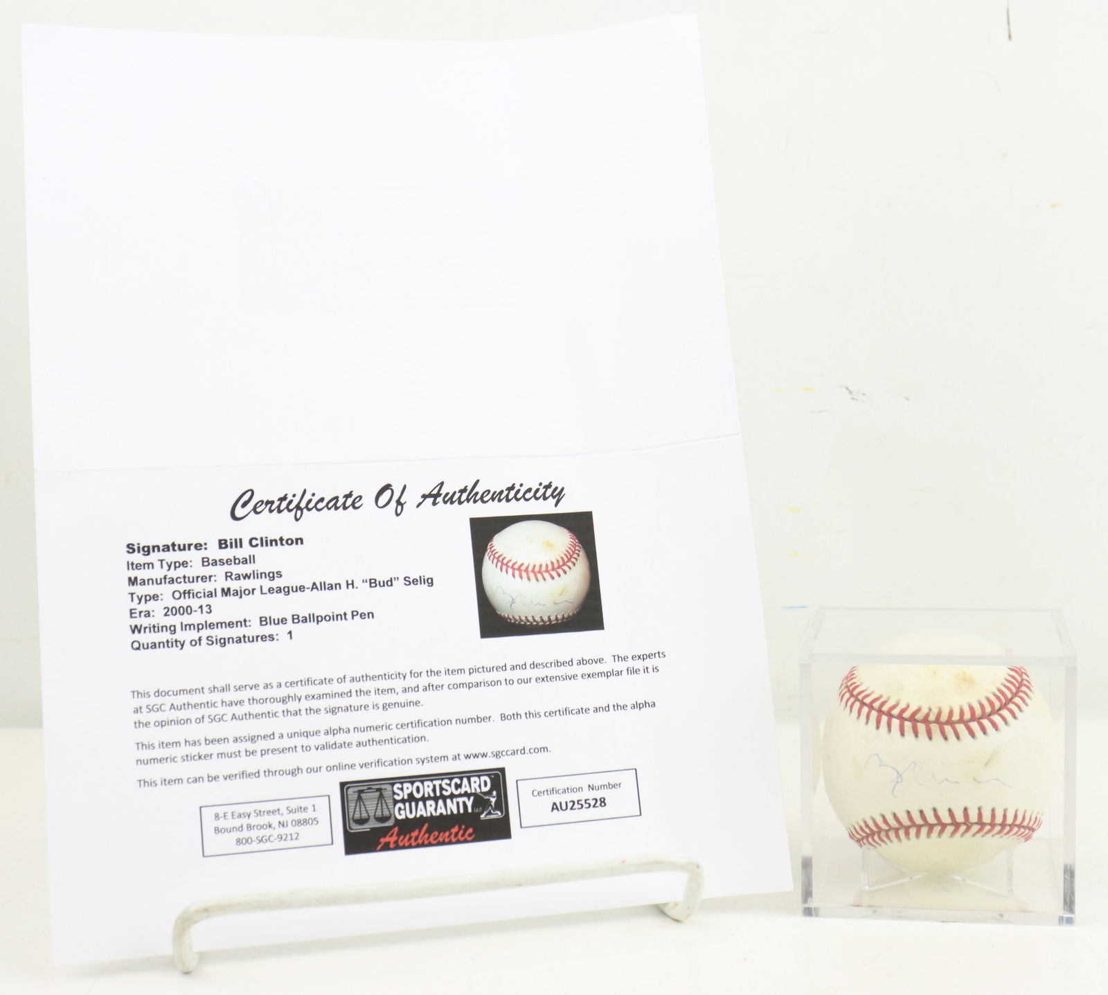President Bill Clinton Autographed Baseball: This is an officially licensed Major League Baseball signed by President Bill Clinton. The ball bears the signature of then-commissioner Allan H. (Bud) Selig and features Clinton's blue ballpoint pen