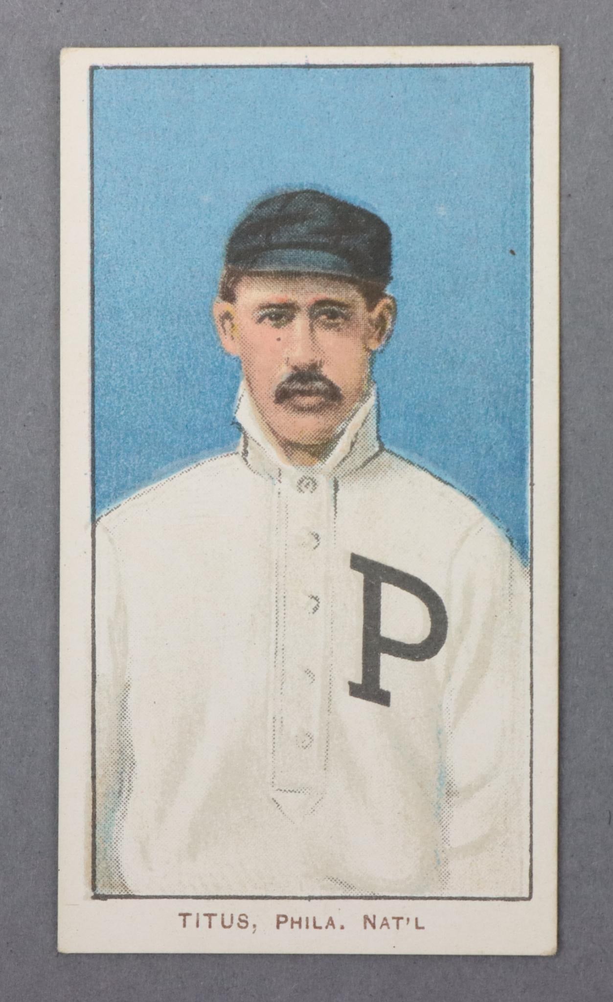 1909-11 T206 Piedmont John Titus Baseball Tobacco Card: 1909-11 T206 Piedmont White Border John Titus baseball tobacco card. The card is free of creases, has nice centering & excellent corners, it features a Piedmont 350 Subjects ad back and a factory 25 c