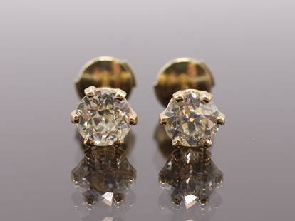 14k YG Diamond Earrings: 14k yellow gold diamond stud earrings, approx. .75 and .72 carats. 1.1dwt
