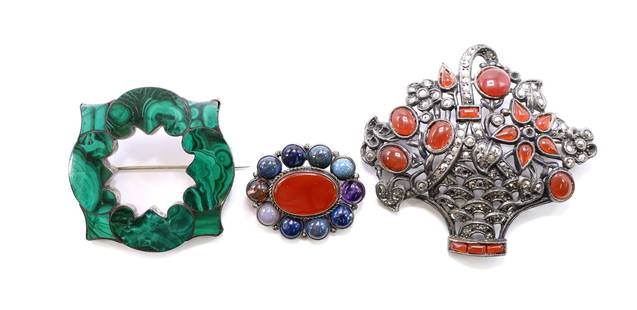 Scottish Sterling Silver Pins: Victorian Scottish malachite agate brooch with scalloped border, a multistone cabochon brooch featuring lapis, amethyst, and carnelian, and a floral fan-form brooch set with coral glass accents and ma