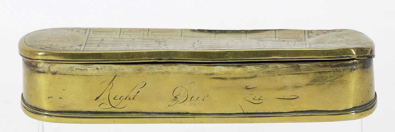 Dutch Engraved Snuff Box, Pieter Holm's “Dutchman’s Log??, 18th c.: 18th century brass tobacco box with rounded ends and hinged lid, commonly referred to as a “Dutchman’s Log” and attributed to Pieter Holm (1685/6–1776). The top is engraved with a perpetua