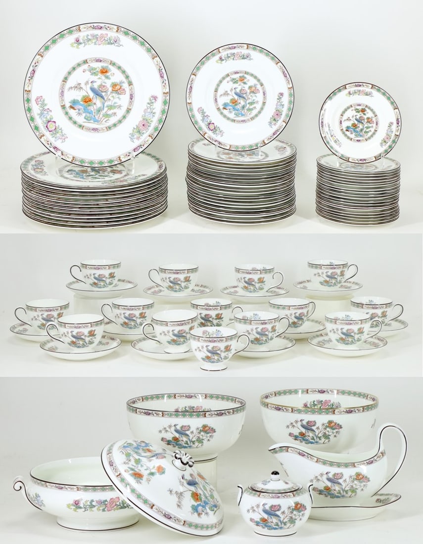 Wedgwood Kutani Crane China Service: Wedgwood bone china dinner service in the "Kutani Crane" pattern, R4464. The service has multicolored floral borders with peacocks and includes dinner plates, salad and bread plates, teacups and sauce