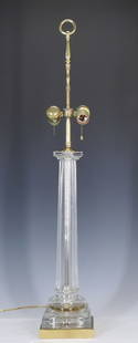 Table Lamp by Chapman Manufacturing: Molded glass stem tapering to brass square base, two sockets currently in working order and marked "Chapman, 1972". 34"h x 5.5" square