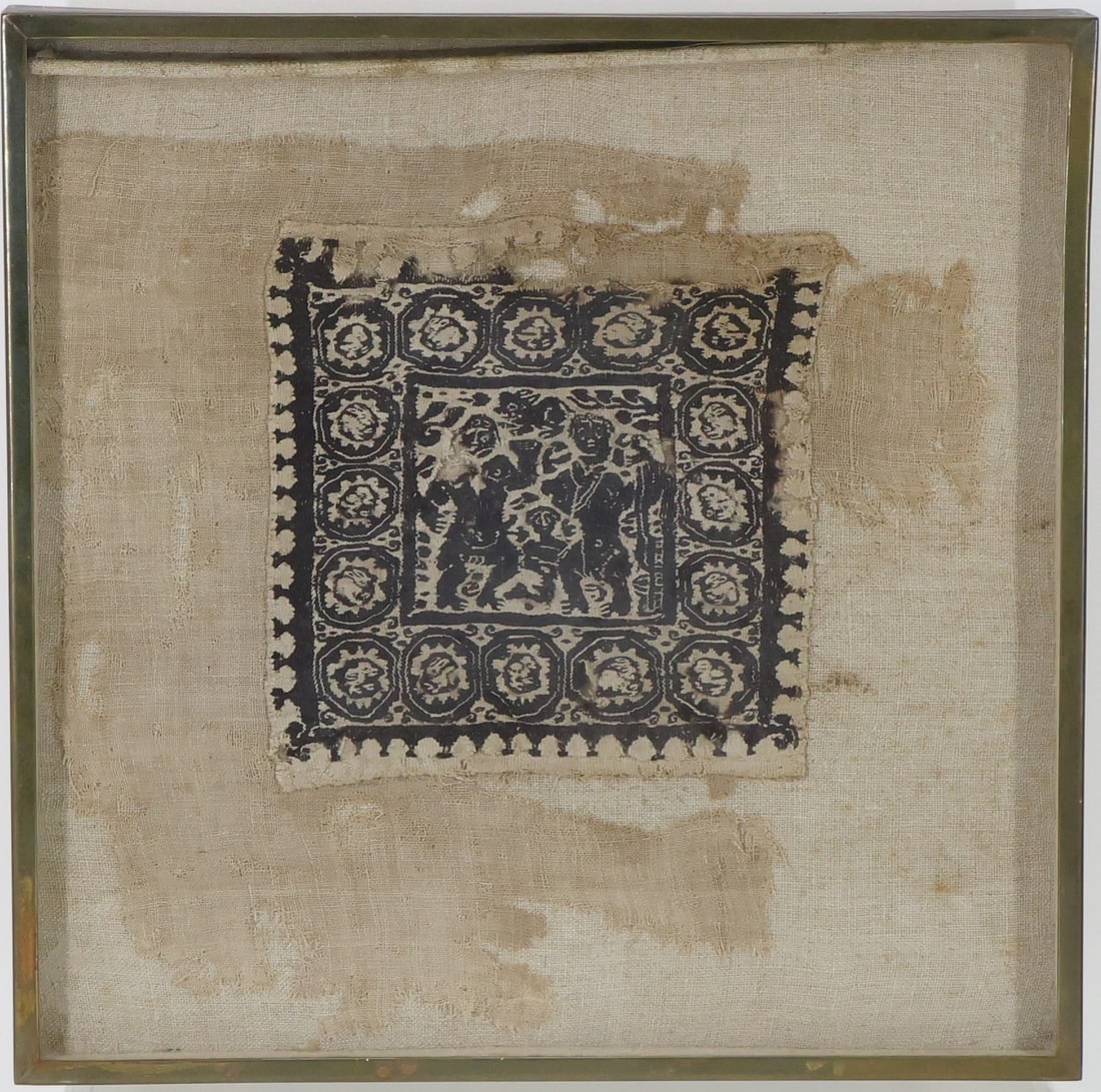 Coptic Embroidery: Framed 5th/6th century Coptic embroidery being a central wool/linen square measuring 6" x 6" presenting a central black and white square featuring human figures with an animal lozenge surround. This s
