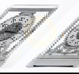 Jaeger-LeCoultre Rhodium Plated Atmos Clock: Atmos II, serial no. 7816, circa early 1940's, with an Arabic numeral dial. Also numbered 6786 to the front of the movement. In working condition, but may need adjustment. 9.5"h x 8.25"w x 6.5"d