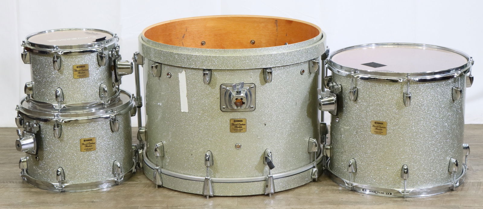 Yamaha 4 Pieces Birch Custom "Absolute" Drums: 4 Pieces Yamaha Birch Custom "Absolute" Drums, Japan. Champagne Sparkle. Includes 10", 13", 16", Mounted Tom and 22" Bass Drum, Missing One Head. No Mounting Hardware. Good Used Conditon. Largest 17.5