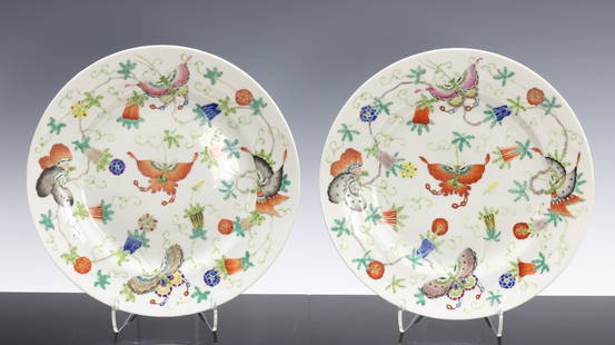 Chinese Famille Rose Plates: Republic era or later pair of porcelain plates decorated with enameled butterflies and gourds. Spurious Qianlong iron red four character reign marks to the feet. 9"w