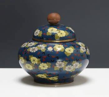Japanese Cloisonne Jar: Meiji - Taisho era silver wire cloisonne covered censer with chrysanthemum and butterfly decoration over a midnight blue ground, with a bud finial and gold washed copper mounts. 3.5"h x 3.75"w