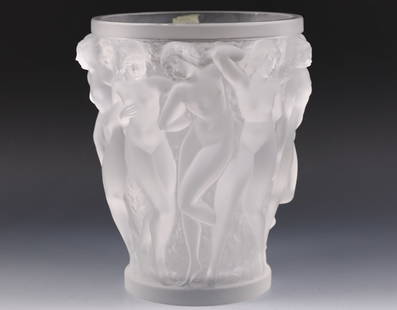 Lalique Bacchantes Crystal Vase: French molded crystal flower vase, frosted with dancing nudes in relief set against a textured background, with engraved markings, and original label. 9.75"h x 8.25"w overall