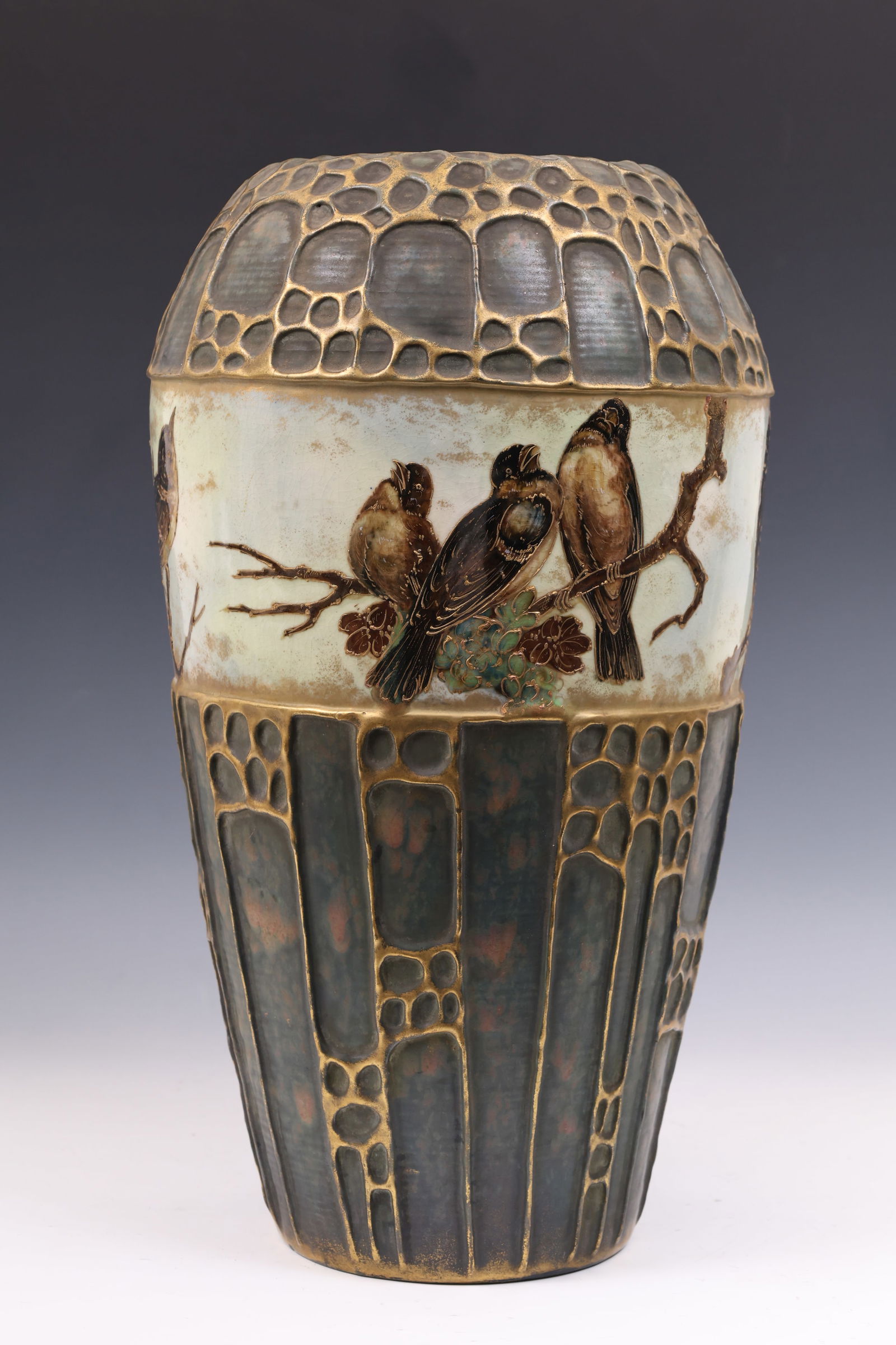 Amphora Pottery Vase: Jugendstihl / Austrian Art Nouveau pottery vase with a band depicting birds in branches with textured gilt accents, surrounded by a gilt honeycomb pattern in relief against a mottled earthtone ground.