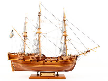 Wooden Model of H.M.S. Grimsby, Plymouth 1776: Wood ship model of the H.M.S. Grimsby, built by Stephen M. Hutsko of Palermo, New Jersey, signed "Shutsko 89" on the underside, displayed on a custom stand with engraved brass plaque. Features include