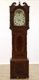 English Tall Case Clock: Mahogany veneered case with banded inlay, broken arch pedimnet with brass finial and hood columns, shaped waist door flanked by truned fluted colunms, molded plinth base, shaped skirt and feet. 8- day