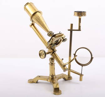 Cary-Gould Type Microscope-19th Century: Early Cary-Gould type microscope with solid brass "Y" base, movable stage, candle holder and light focusing glass. Microscope measures 14.5" in height and is 10" wide and 9" deep (base). Microscope an