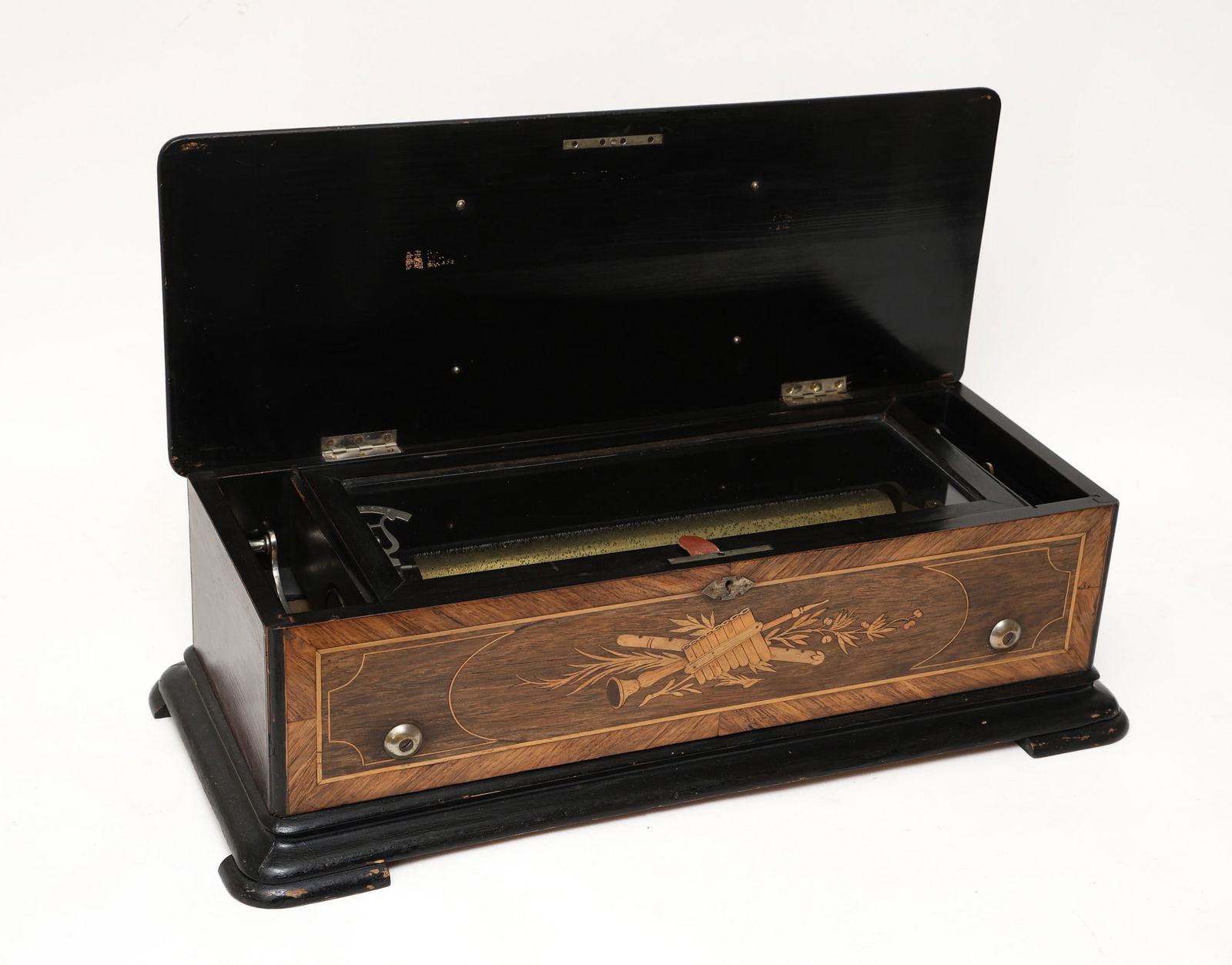 Swiss Cylinder Music Box: No. 18391, brass cylinder, rosewood case with marquetry and banded inlay and shaped feet. Currently in working condition but needs tuning. 8.5"h x 24"w x 10"d