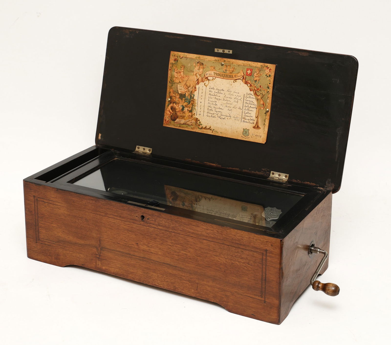 Swiss Cylinder Music Box: No. 54711, plays ten tunes, brass cylinder with external crank mechanism, walnut case. In working condition. 6.5"h x 19.5"w x 9.5"d