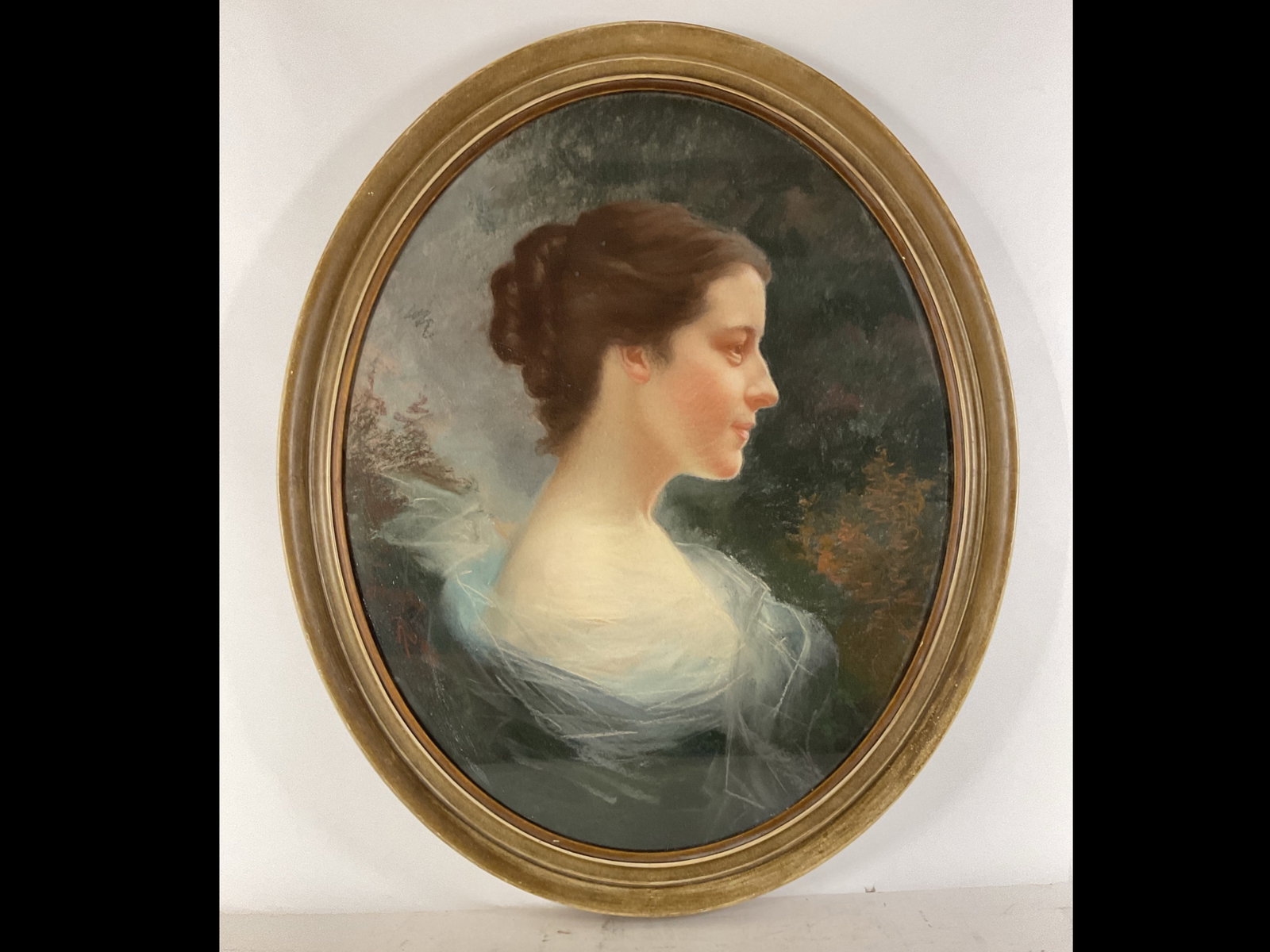 Pastel Portrait: Oval pastel portrait of a young woman in profile with upswept hair done in a soft Romantic style. Unsigned. 26.5”h x 21.5”w sight and 31”h x 26”w framed.