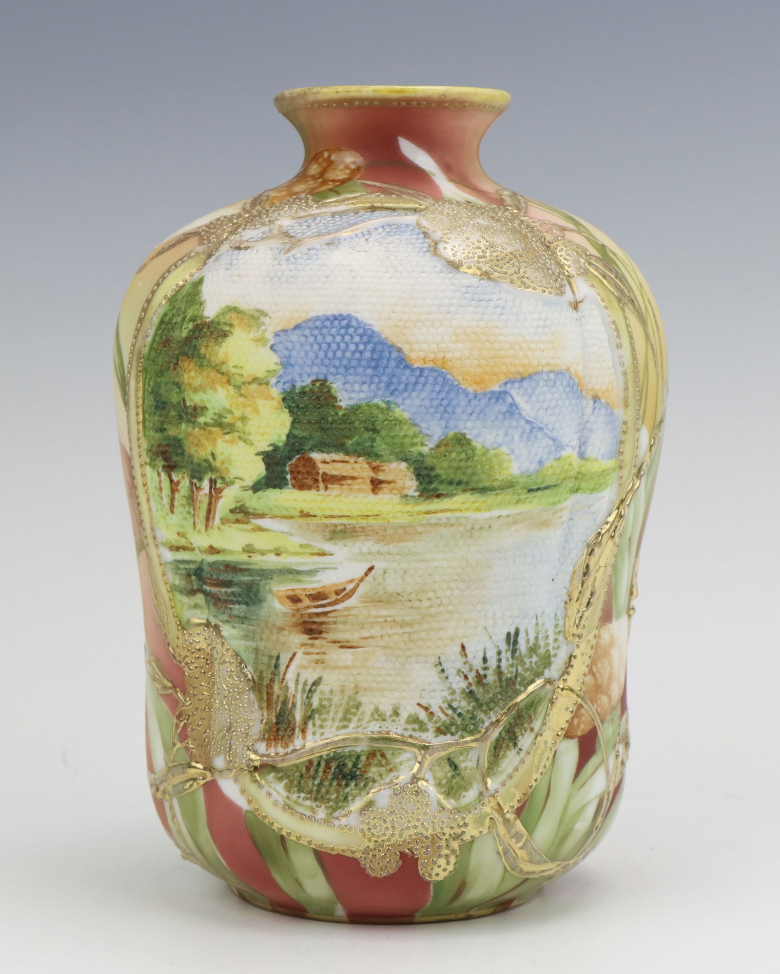 Nippon Tapestry Vase: Nippon porcelain tapestry vase, hand painted floral riverscape design, jewel gilt detailing, marked, 6.5"h x 4.25"dia.