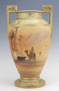 Nippon Porcelain Vase: Nippon porcelain footed vase, c. 1891-1921, hand painted Egyptian desert, decorative geometric style handles, marked, moriage detailing, 13"h x 7.5"w x 7.25"d.