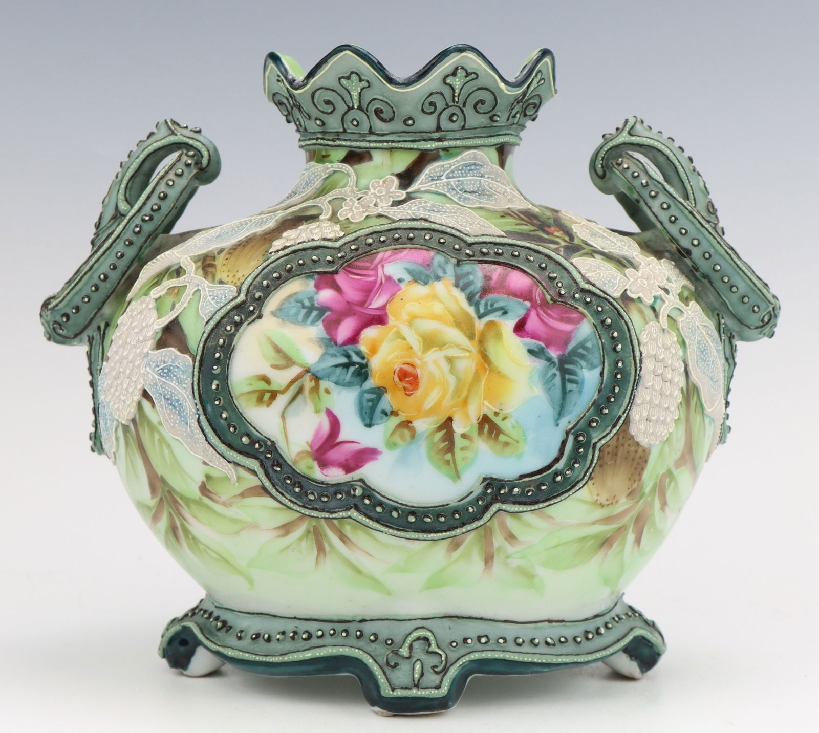 Nippon Porcelain Vase: Nippon porcelain vase, c. 1891-1921, hand painted floral motif with moriage decoration, marked, 6.25"h x 7.5"w x 4.75"d.