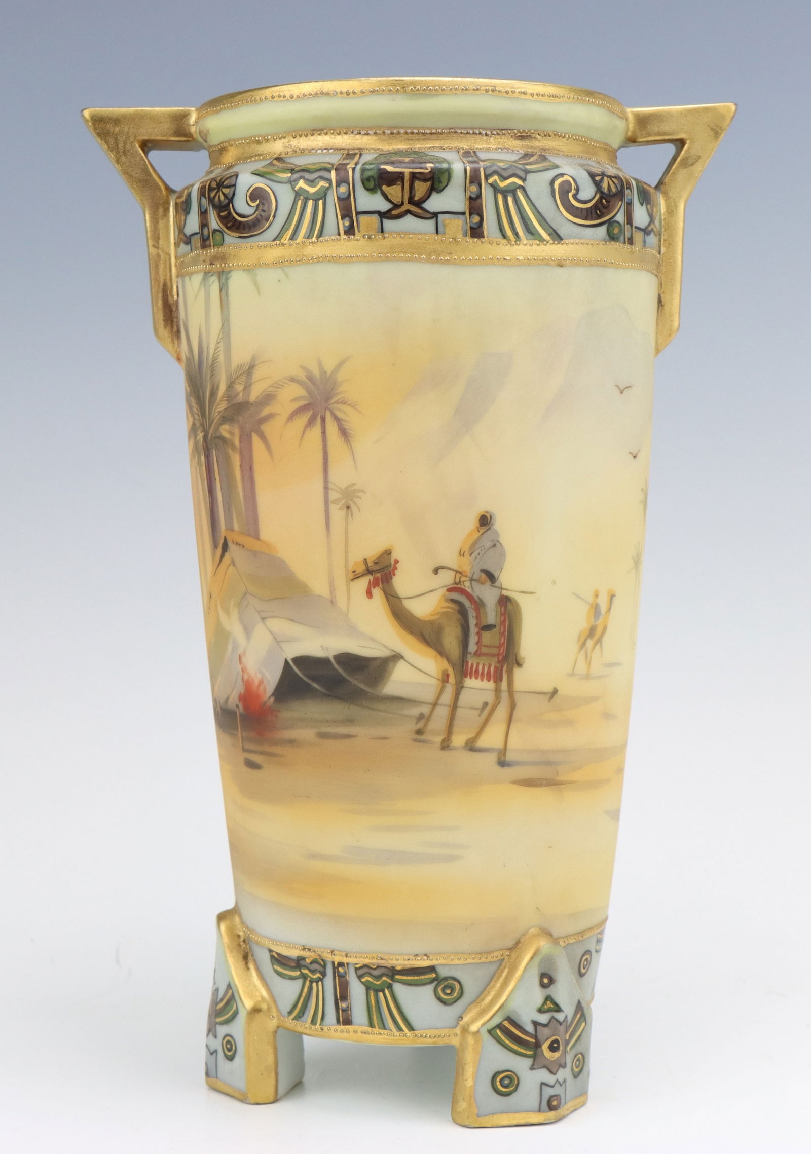 Nippon Porcelain Vase: Nippon porcelain vase, c. 1891-1921, hand painted Egyptian desert, footed, gilt decoration, marked, 8.5"h x 5.75"w x 4.25"d.