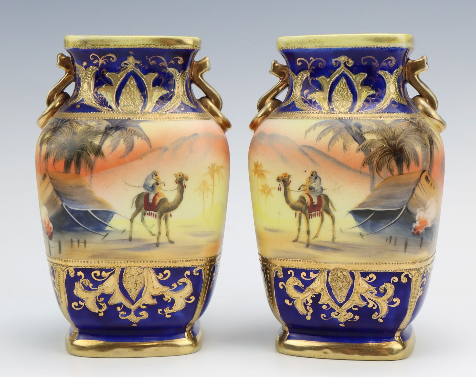 Noritake Porcelain Vases: Noritake porcelain vases (2), marked Egyptian desert pattern, cobalt, hand painted, each 6"h x 3.75"w x 3"d.