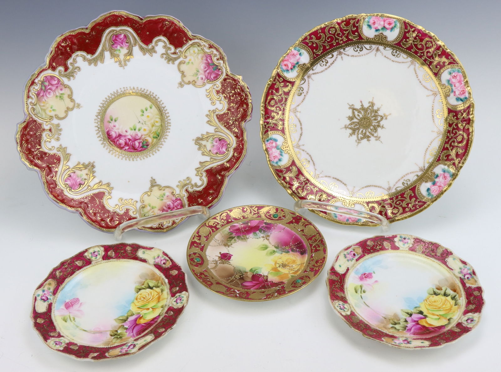 Nippon Plates: Nippon porcelain plates (5, one signed - see images), c. 1891-1921, hand painted with moriage decoration, marked, largest plate 1"h x 11"w x 10.75"d.