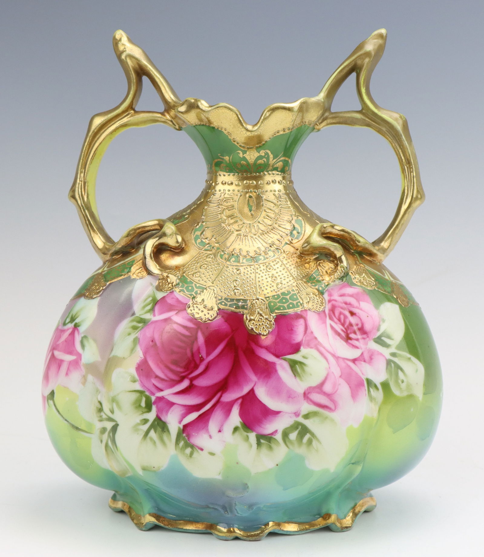 Nippon Porcelain Vase: Nippon porcelain vase, c. 1891-1921, hand painted floral motif with moriage decoration, marked, 8.75"h x 7"w x 5"d.
