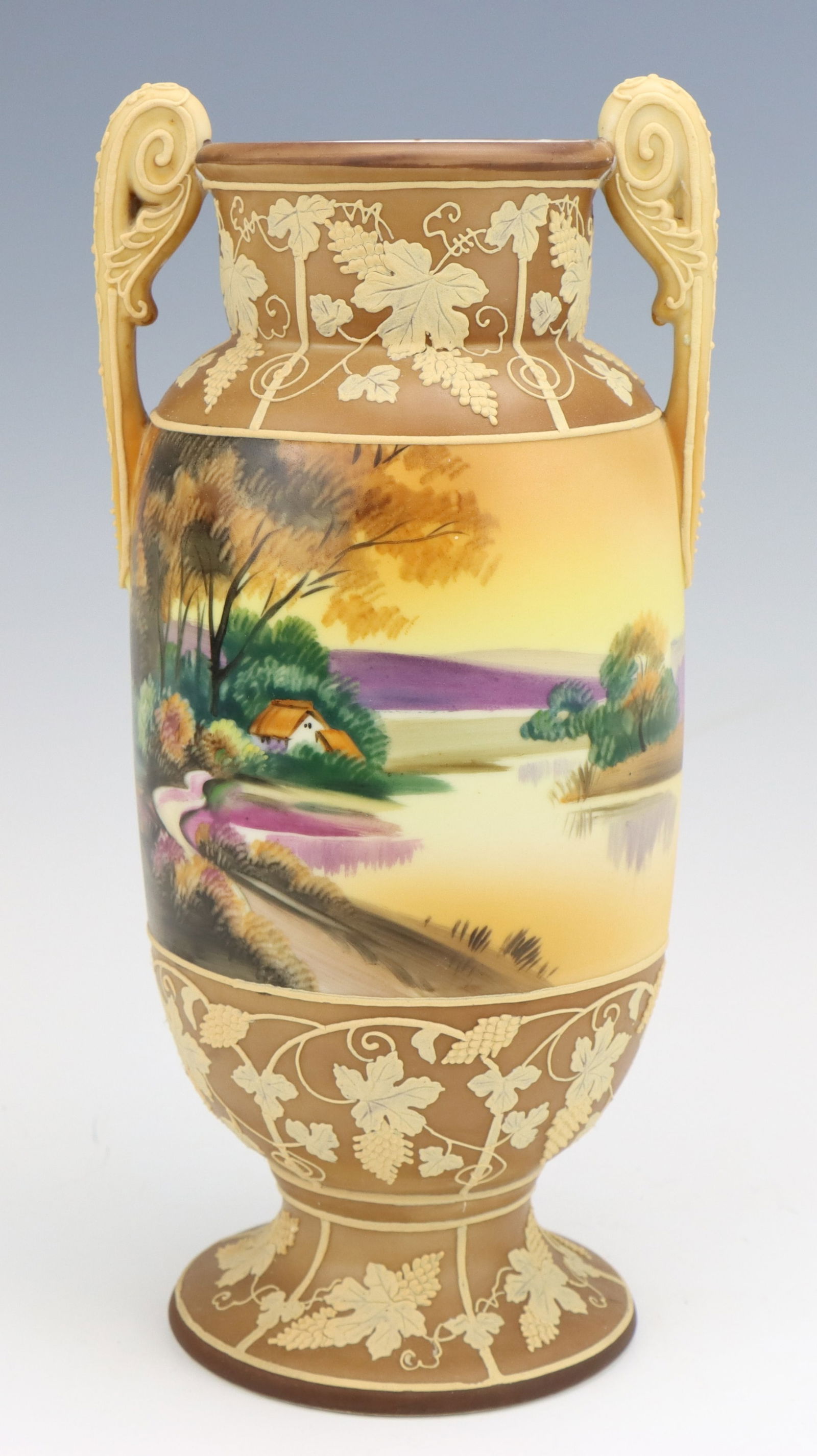 Nippon Porcelain Vase: Nippon porcelain vase, c. 1891-1921, hand painted cottage landscape scenes with grapevine moriage decoration, marked, 10.75"h x 5"dia.