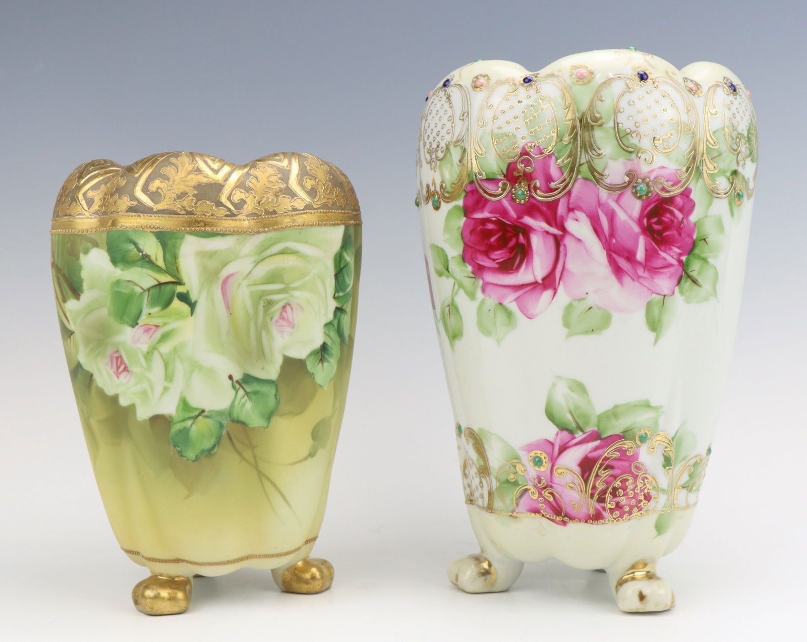 Nippon Porcelain Vases: Nippon porcelain vases (2), c. 1891-1921, hand painted floral motifs with clawfoot style feet and scalloped sides, moriage decoration, marked, larger 8.25"h x 5.5"dia.