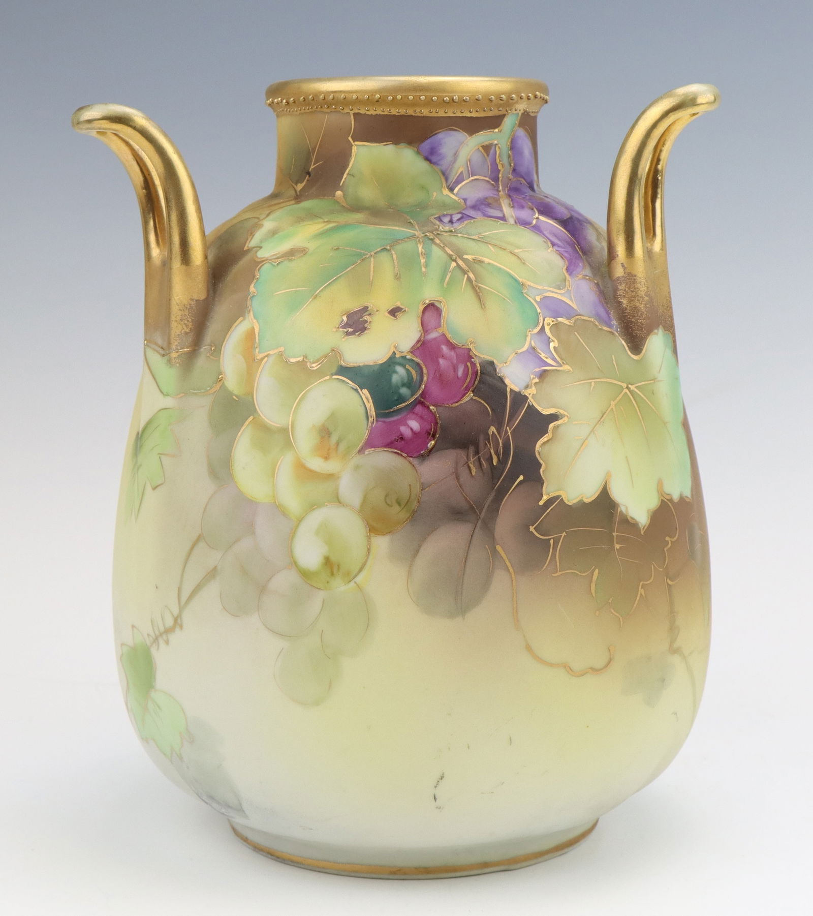 Nippon Porcelain Vase: Nippon porcelain vase, c. 1891-1921, hand painted grapevine motif with gilt moriage decoration, marked, 8"h x 6.5"dia.