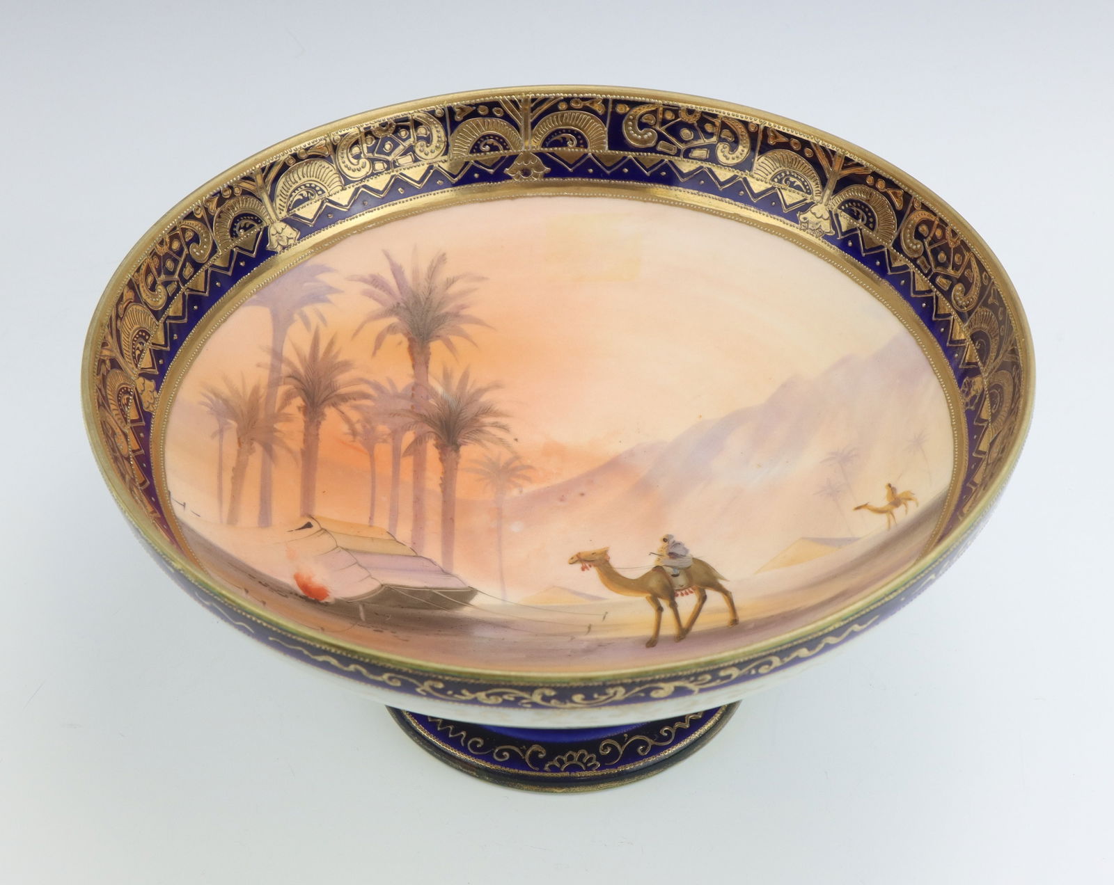 Noritake Porcelain Bowl: Noritake porcelain compote dish, hand painted Egyptian desert pattern, cobalt, marked, 5"h x 10"dia.