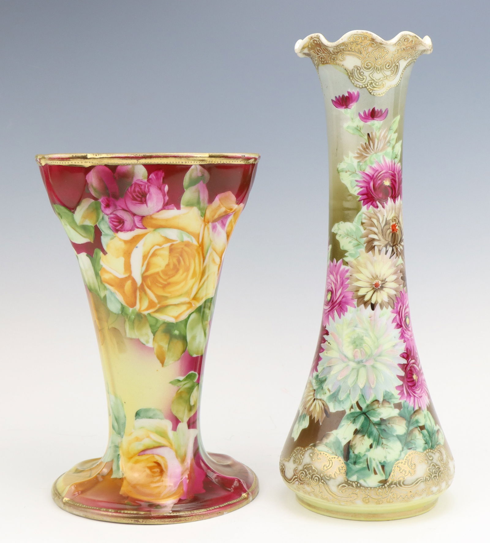 Nippon Porcelain Vases: Nippon porcelain vases (2), c. 1891-1921, hand painted floral motifs with gilt decoration, smaller vase has hairline cracks on base, marked, larger 11.5"h x 4.5"dia.
