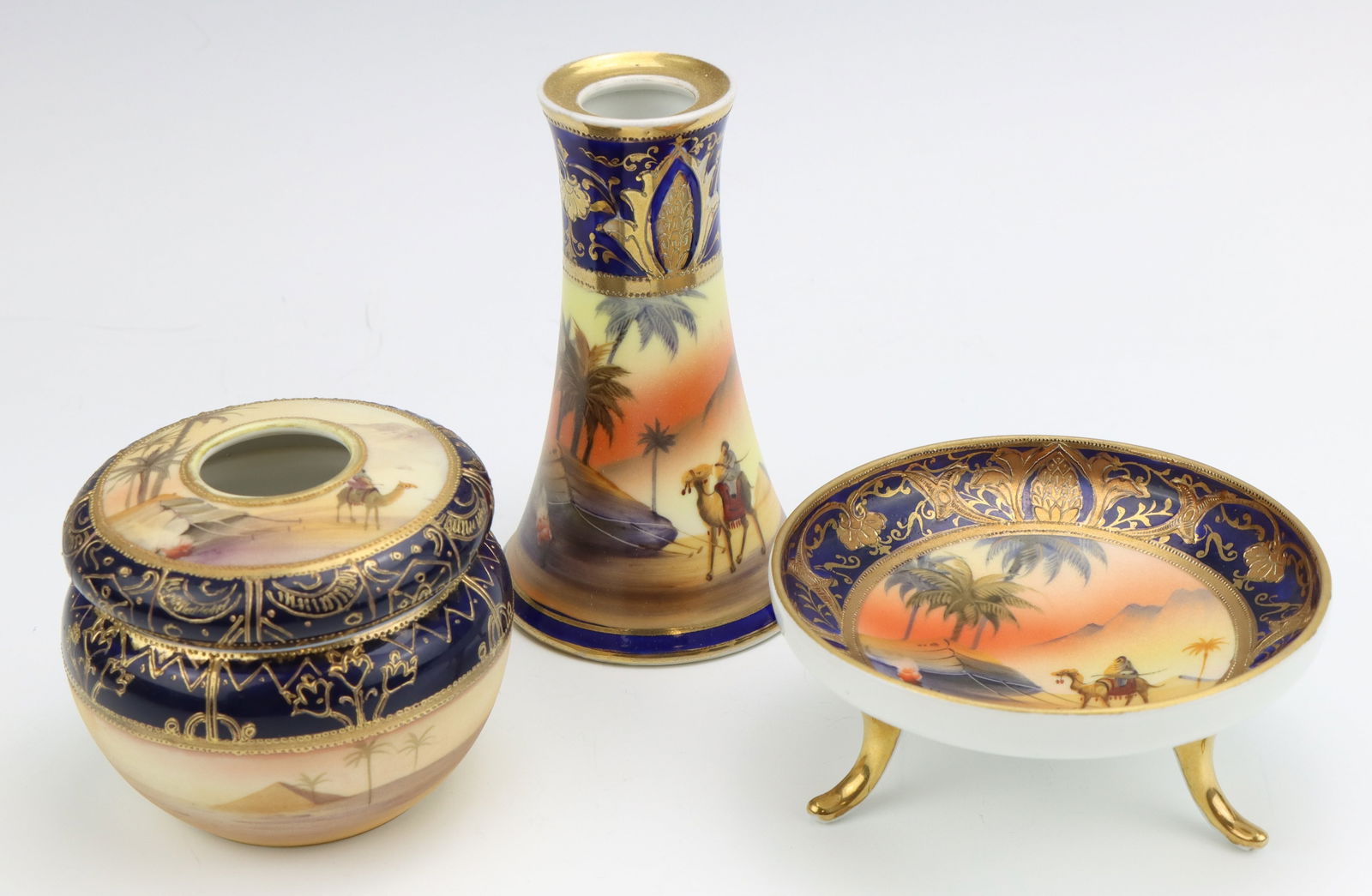 Noritake Vanity Accessories: Noritake porcelain vanity accessories, including candle holder, lidded hair receiver and footed trinket bowl, hand painted Egyptian desert pattern, marked, cobalt, vase 4.75"h x 3"dia.