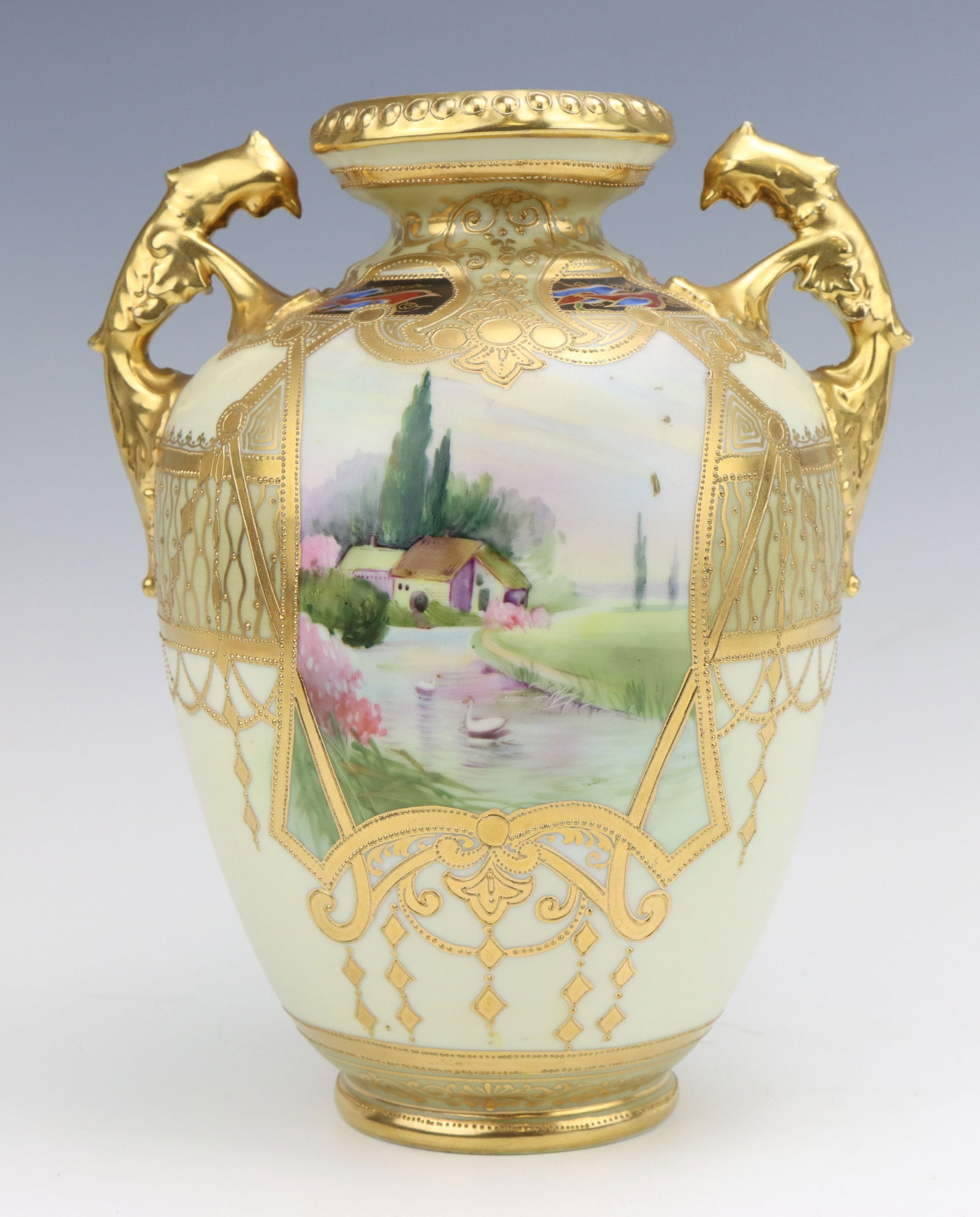 Nippon Porcelain Vase: Nippon porcelain vase, c. 1891-1921, hand painted cottage pond scenes with gilt moriage decoration, marked,10"h x 8"w x 6.5"d.