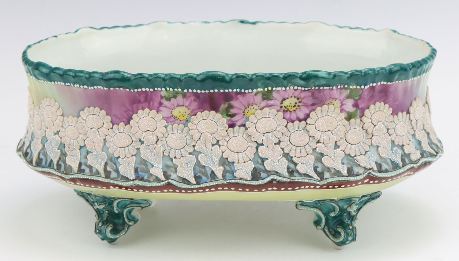 Nippon Porcelain: Nippon porcelain vessel, c. 1891-1921, hand painted and raised floral motif with jeweled and moriage decoration, marked, 3.75"h x 9"w x 6.25"d.