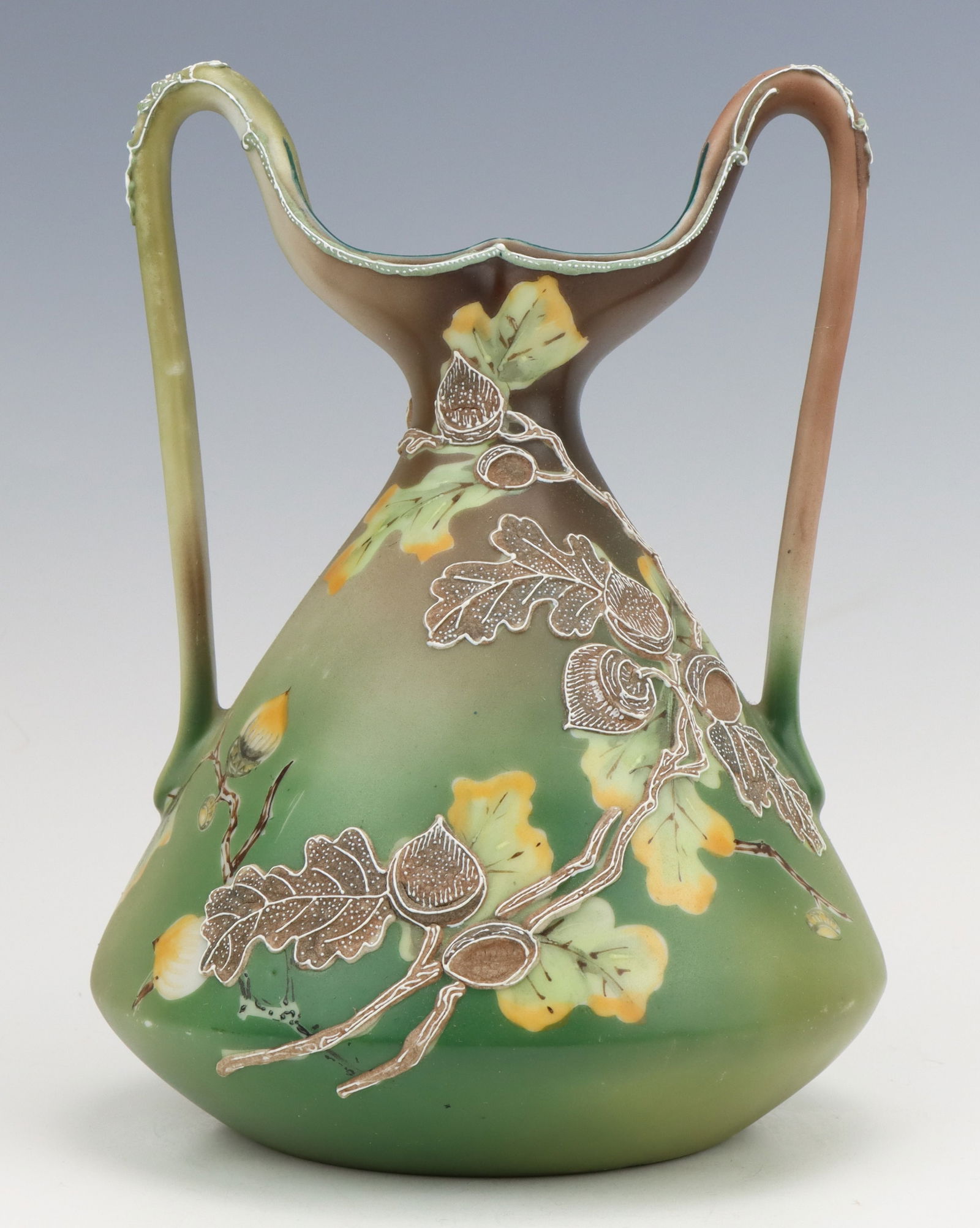 Nippon Porcelain Vase: Nippon porcelain vase, c. 1891-1921, hand painted maple/acorn motif, moriage decoration, surface wear on bottom, marked, 8.25"h x 6.25"dia.