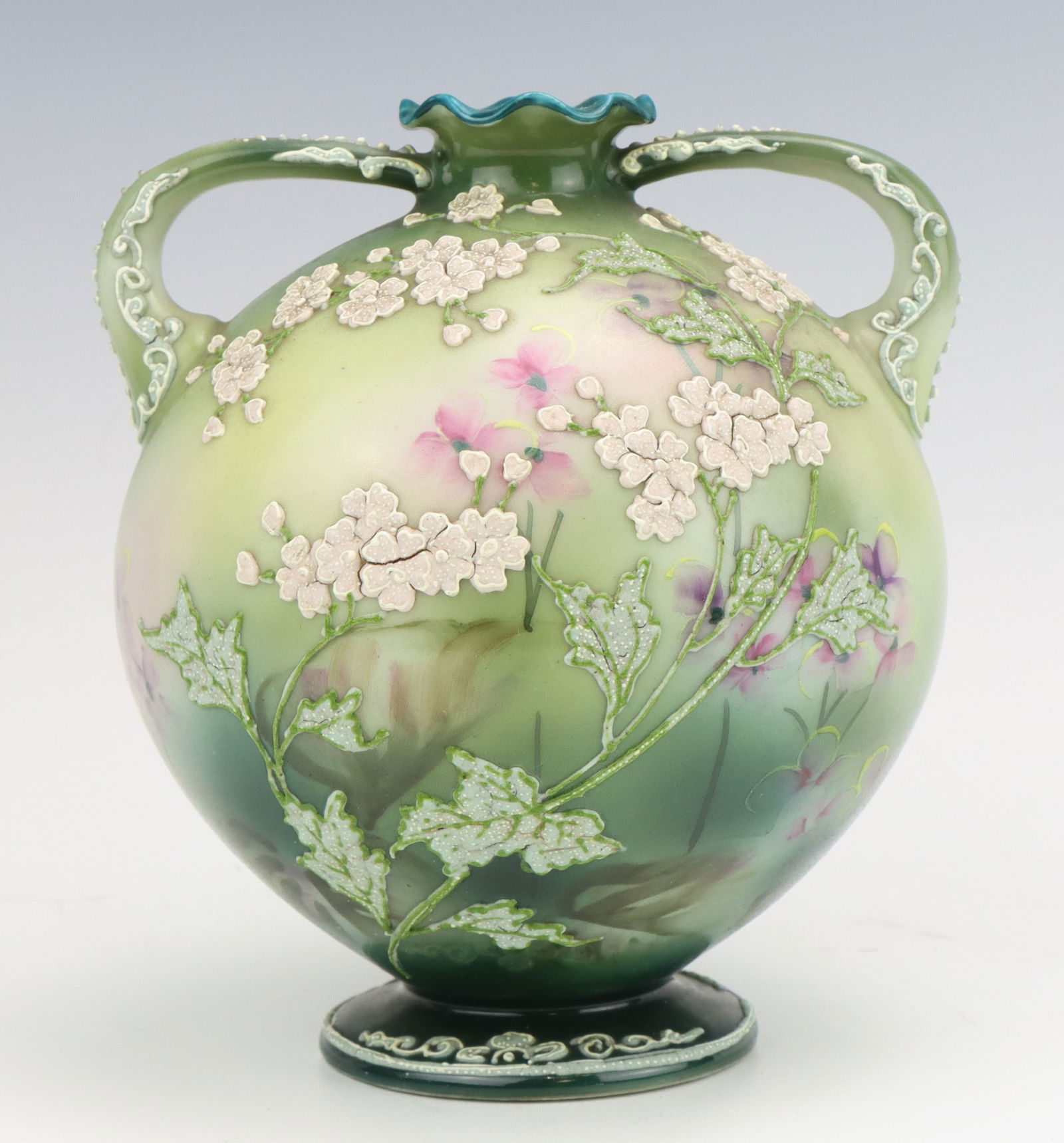Nippon Porcelain Vase: Nippon porcelain vase, c. 1891-1921, hand painted floral motif, pale green hues with moriage decoration, marked, 6"h x 5.5"w x 5.25"d.