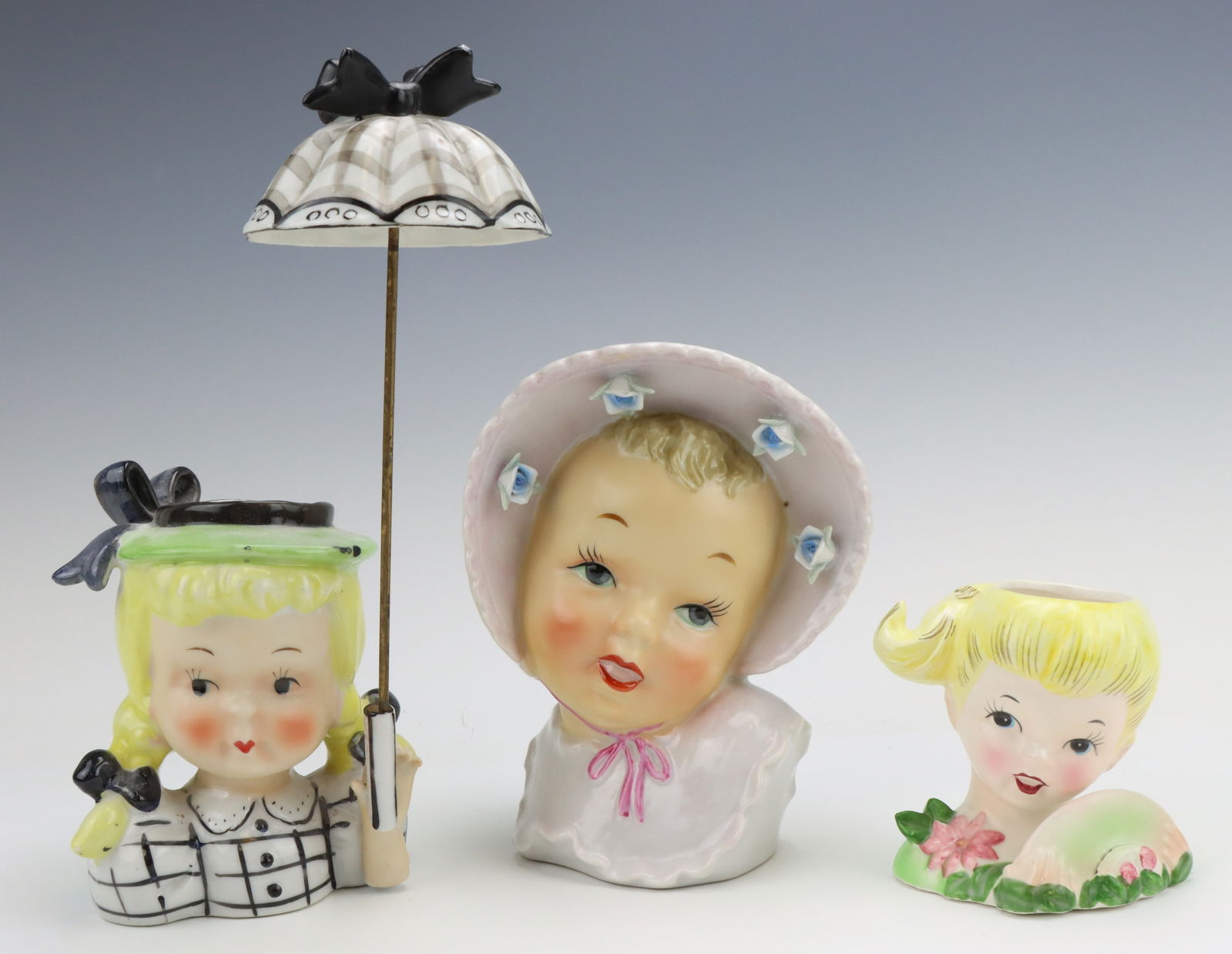 Youth Head Vases: Youth head vases (3), unmarked, all hand painted, smallest vase has small indentation for a place card or greetings, Umbrella Girl vase includes her umbrella accessory. largest vase 6"h x 4.5"w x 3"d