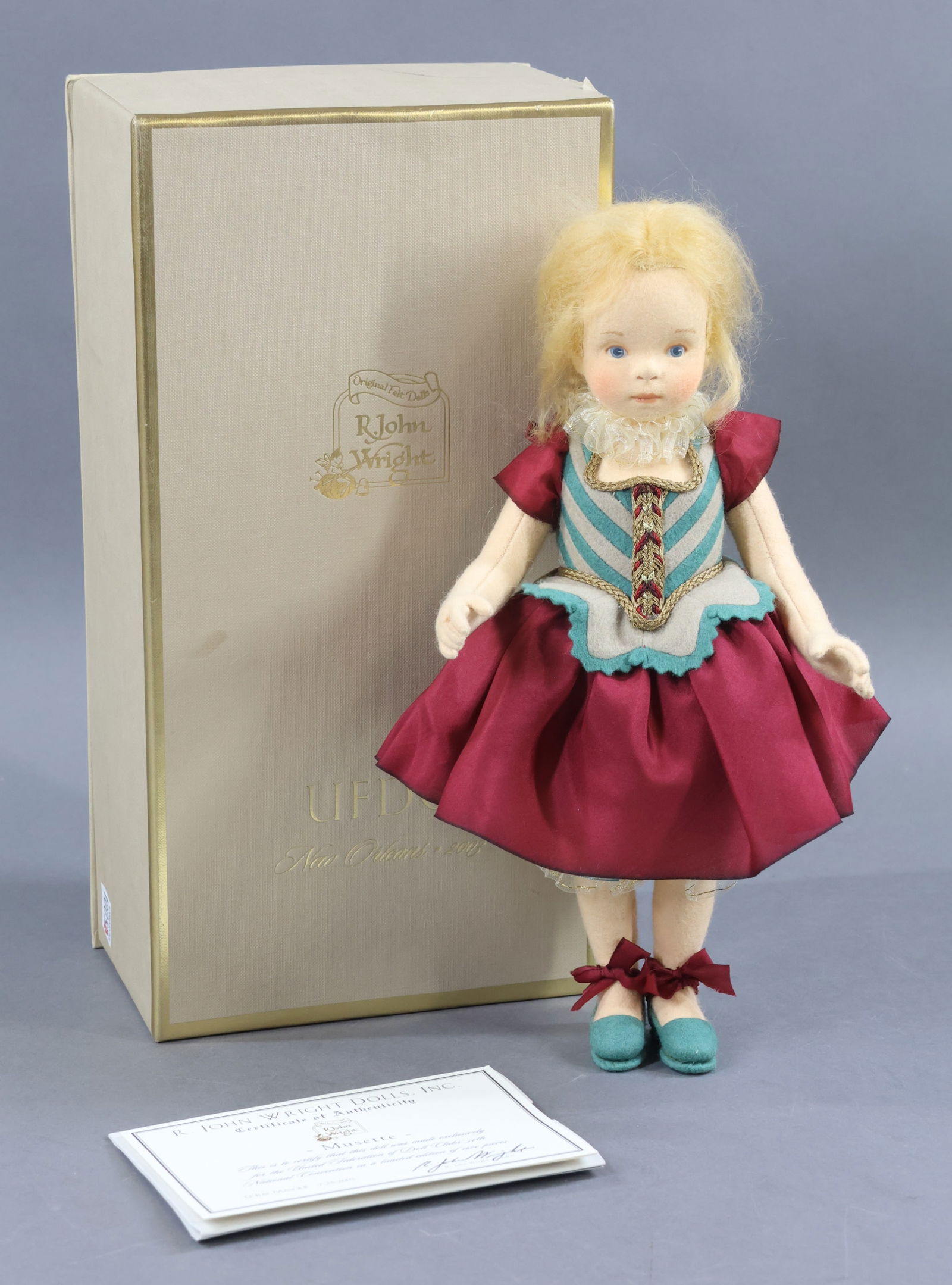 R. JOHN WRIGHT: MIB 12" 2003 "Musette", from the LaBal Masque. Ltd. Ed. 1600. UFDC 54th National Convention. New Orleans. COA. (She is a candy container.) Condition: age loss on box. This lot is being sold AS IS.