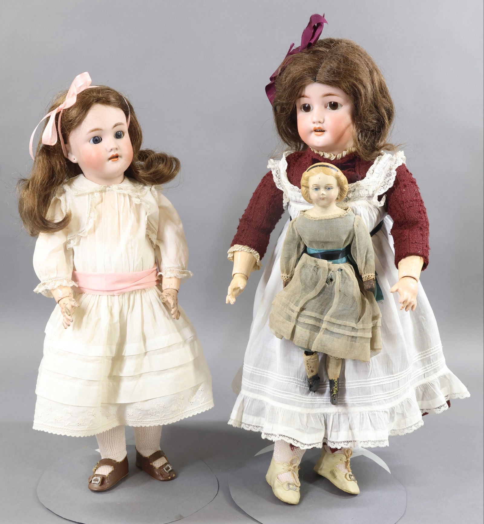 GERMAN BISQUE DOLLS.: LOT of (3) original family owned dolls. Both bisque dolls have stationary eyes, open mouths, brown wigs, papier mache ball jointed bodies. 19" GERMANY HEINRICH HANDWERCK 2 doll with blue eyes, HH wig.