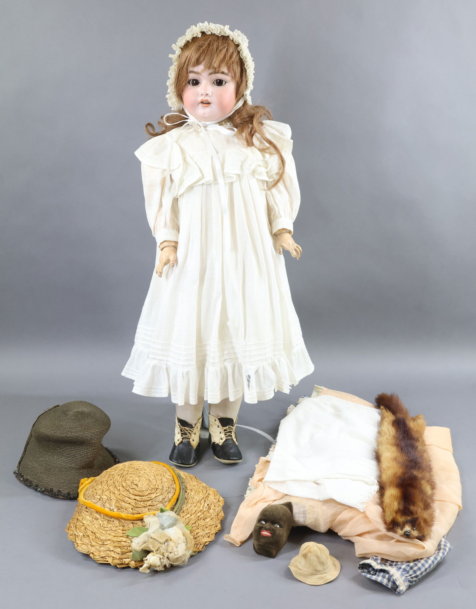 GERMAN BISQUE DOLLS WITH EXTRA CLOTHING.: LOT. 28" S & H 1079 - 13 1/2 DEP Doll with brown sleep eyes, open mouth, pierced ears, brown French HH wig. Papier mache ball jointed body. Dressed in antique white cotton clothing, bonnet, socks. Bla
