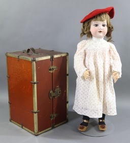 GERMAN BISQUE DOLLS WITH EXTRA CLOTHING.