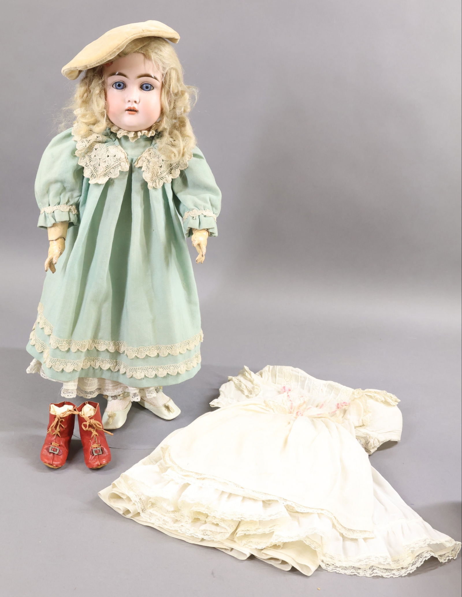 GERMAN BISQUE DOLLS WITH EXTRA CLOTHING.: 21" 1 1/2 MADE IN GERMANY 10 1/2 152 Doll with blue sleep eyes, open mouth, original blonde mohair wig, plaster pate. Papier mache ball jointed body is marked (red stamp) GERMANY 3. Dressed in antique