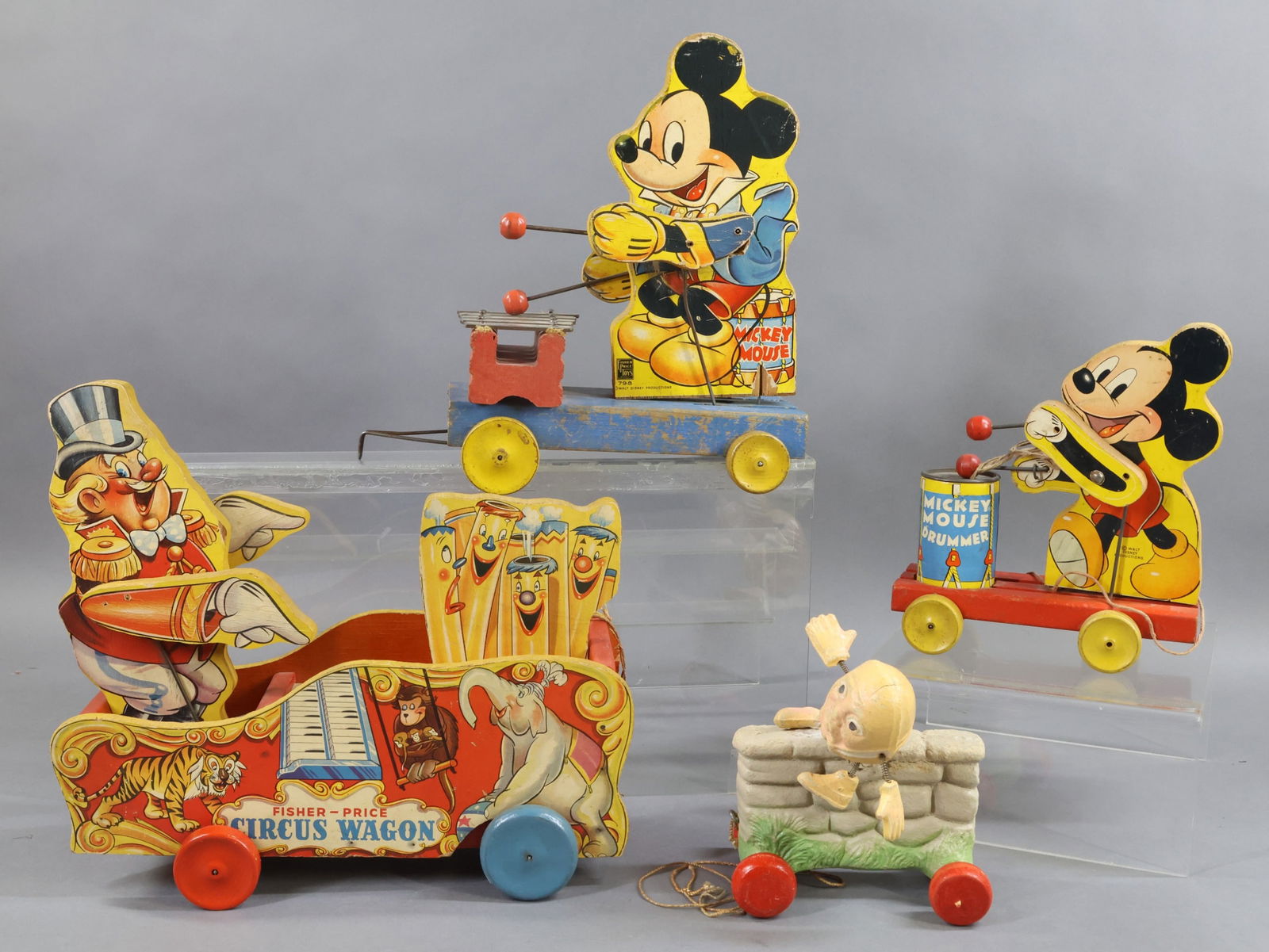 VINTAGE TOYS.: LOT of (4) Pull toys. 12" T x 12 1/2" L 1942 - 1947 #156 FISHER-PRICE "Circus Wagon". 11" T x 9" L 1939 Walt Disney Prod. #798 FISHER-PRICE "Mickey Mouse Xylophone". 8" T x 7 1/2" L late 1930's- early