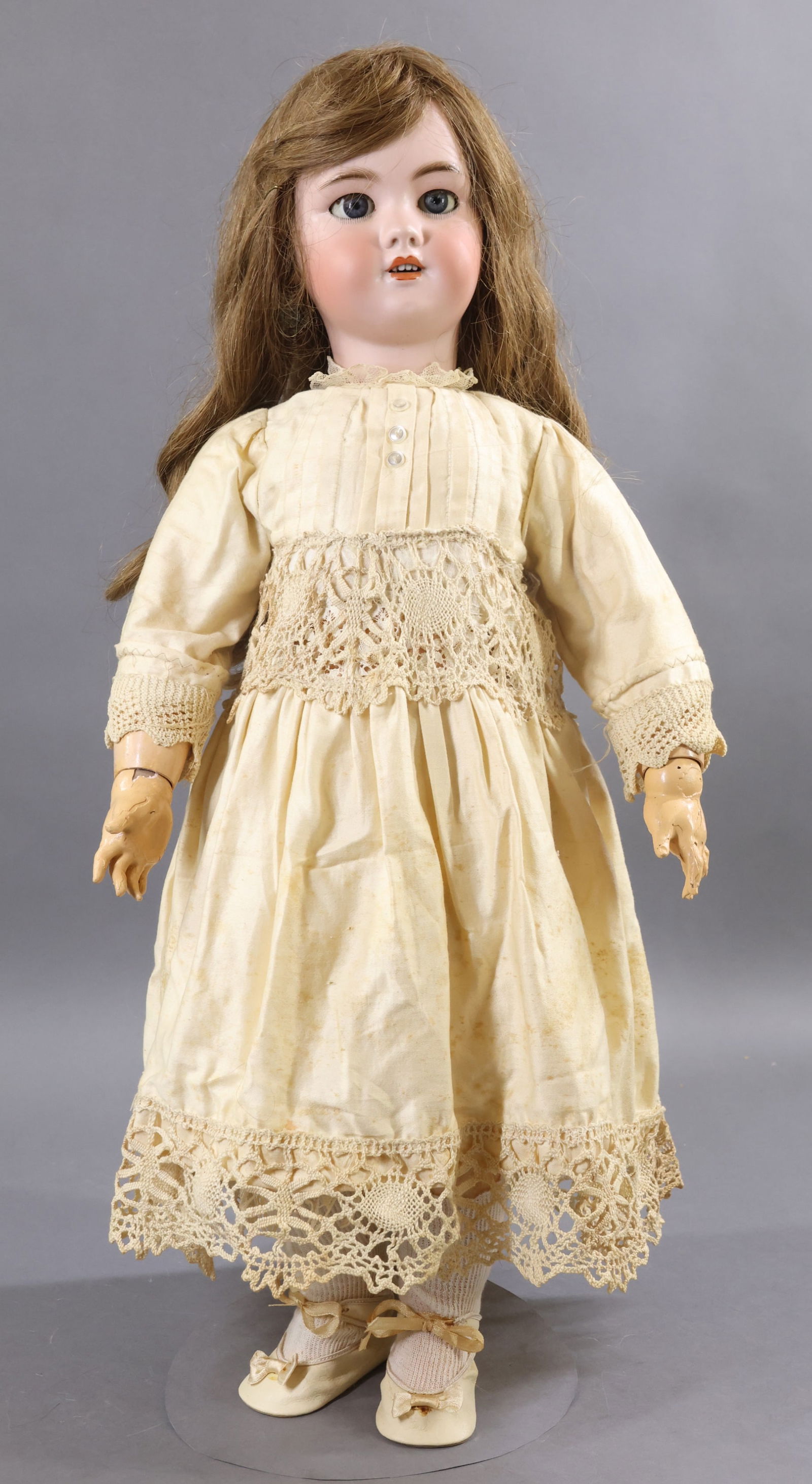 FRENCH/GERMAN BISQUE DOLLS.: 27" (Incised) DEP 12 (stamped) TETE JUMEAU Doll with stationary blue eyes, open mouth, pierced ears, long curled brown FRENCH HH wig. Unmarked FRENCH papier mache jointed body with separate hands. Dre