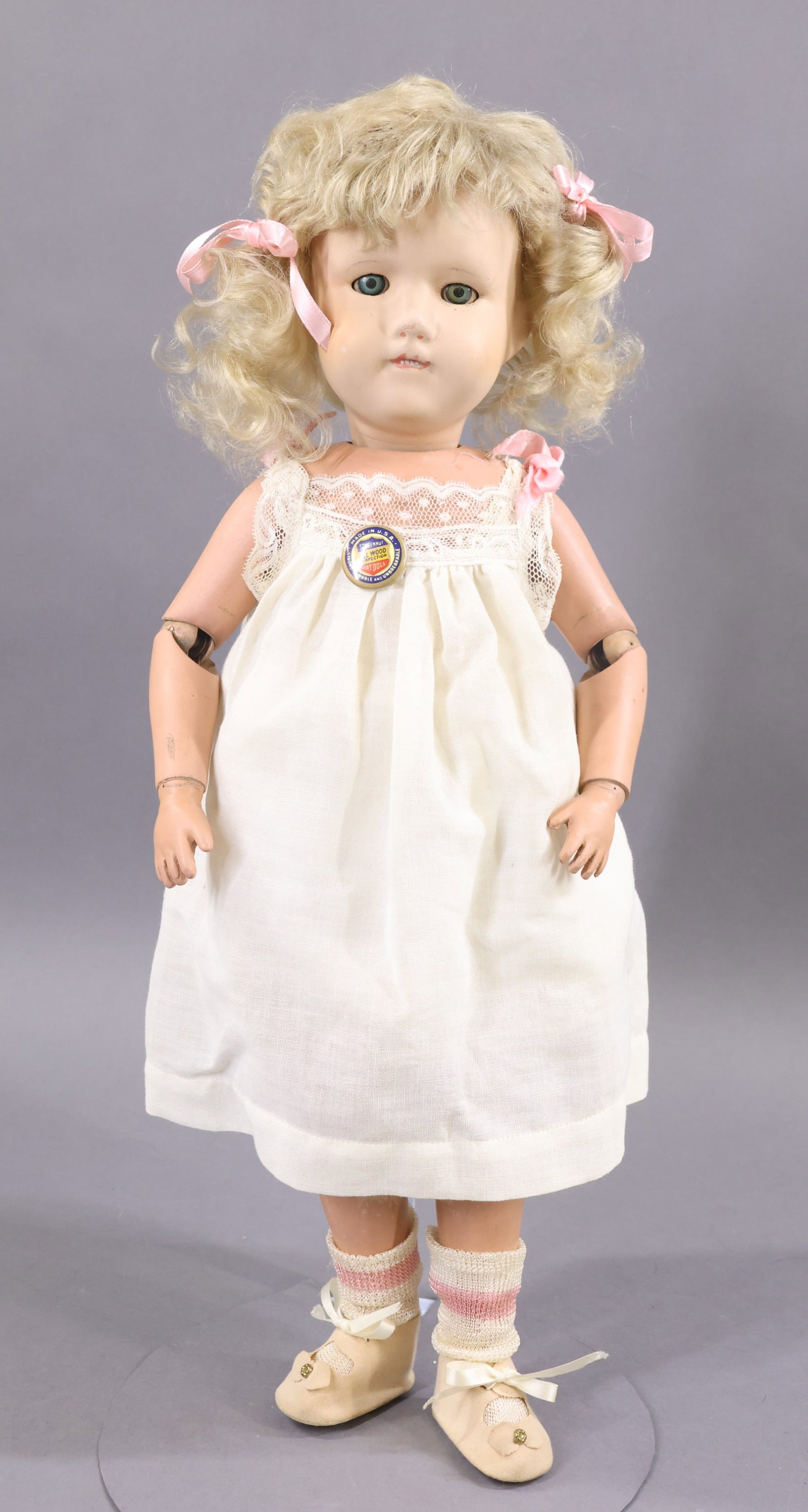 SCHOENHUT.: 19" Model No. 317 "Miss Dolly" SLEEP eye doll. This doll still has the metal spring joints. Blue sleep eyes, four painted teeth. Blonde curly mohair wig. Back of torso has the oval decal. Back of head