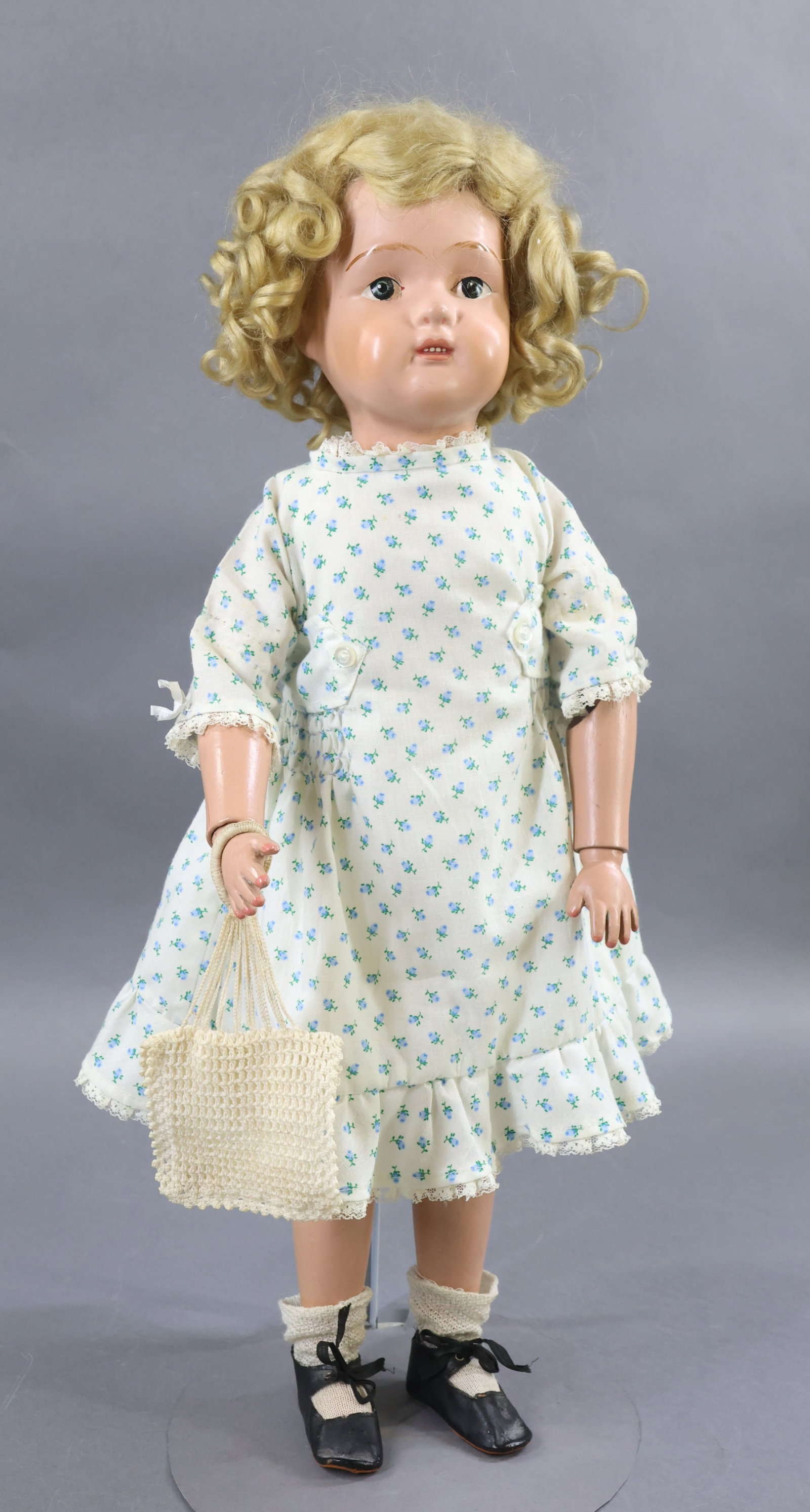 SCHOENHUT.: 22" 1915-1924 Model No. 316 "Miss Dolly" doll. This is the largest size that they made and has her original blonde very curly mohair wig. Back of torso has the oval decal. No original clothing. She is