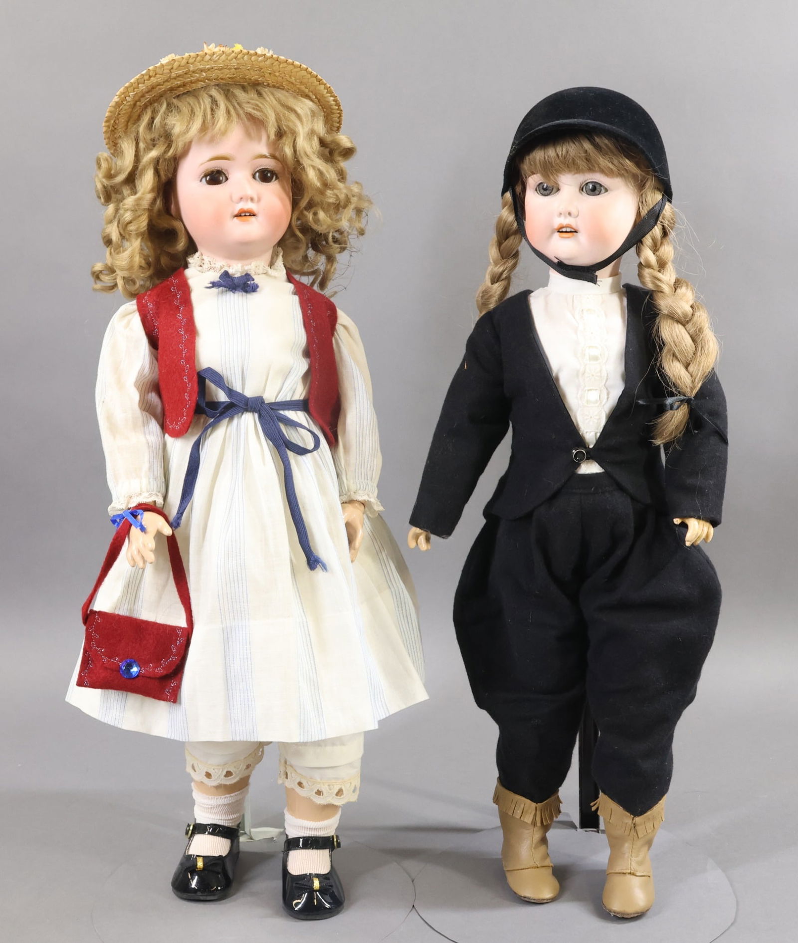 GERMAN BISQUE DOLLS.: Pair of dolls. Both dolls have sleep eyes, open mouths, papier mache ball jointed bodies. Doll 1) 21" GERMANY S (PB in star symbol) H 1909 4. Brown eyes with fluffy lashes, curly dark ash blonde mohai