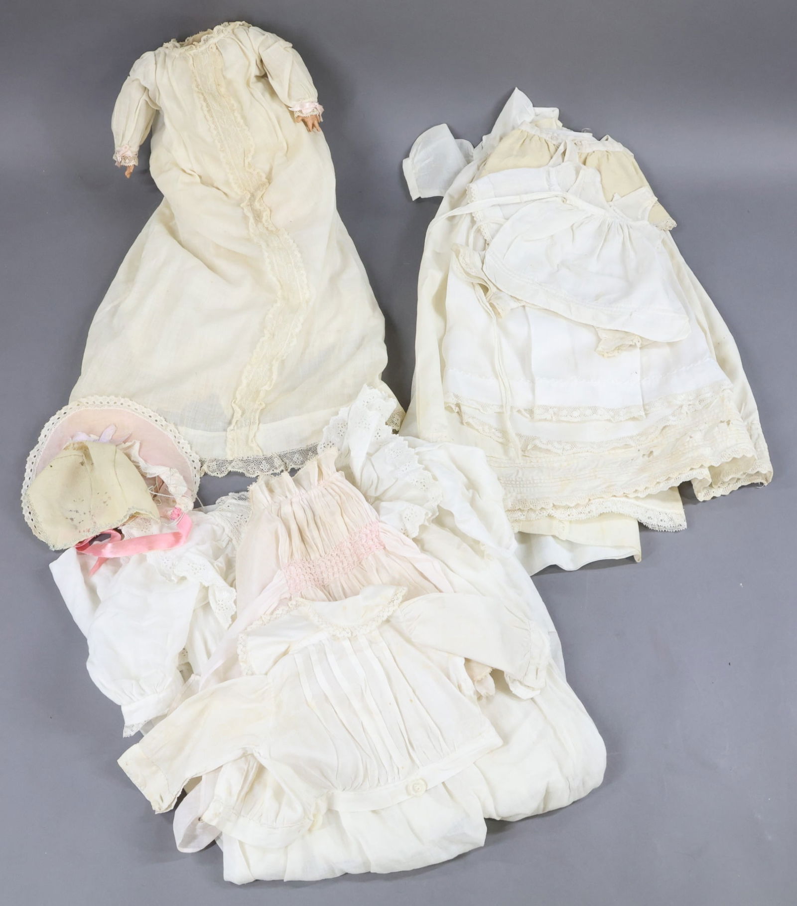 DOLL SUPPLIES.: LOT. Antique 10" cloth BODY with celluloid hands for a bisque baby head (originally came off of a Byelo doll with broken head). Comes with antique gown, petticoat, wool booties. Clothing - white cotto