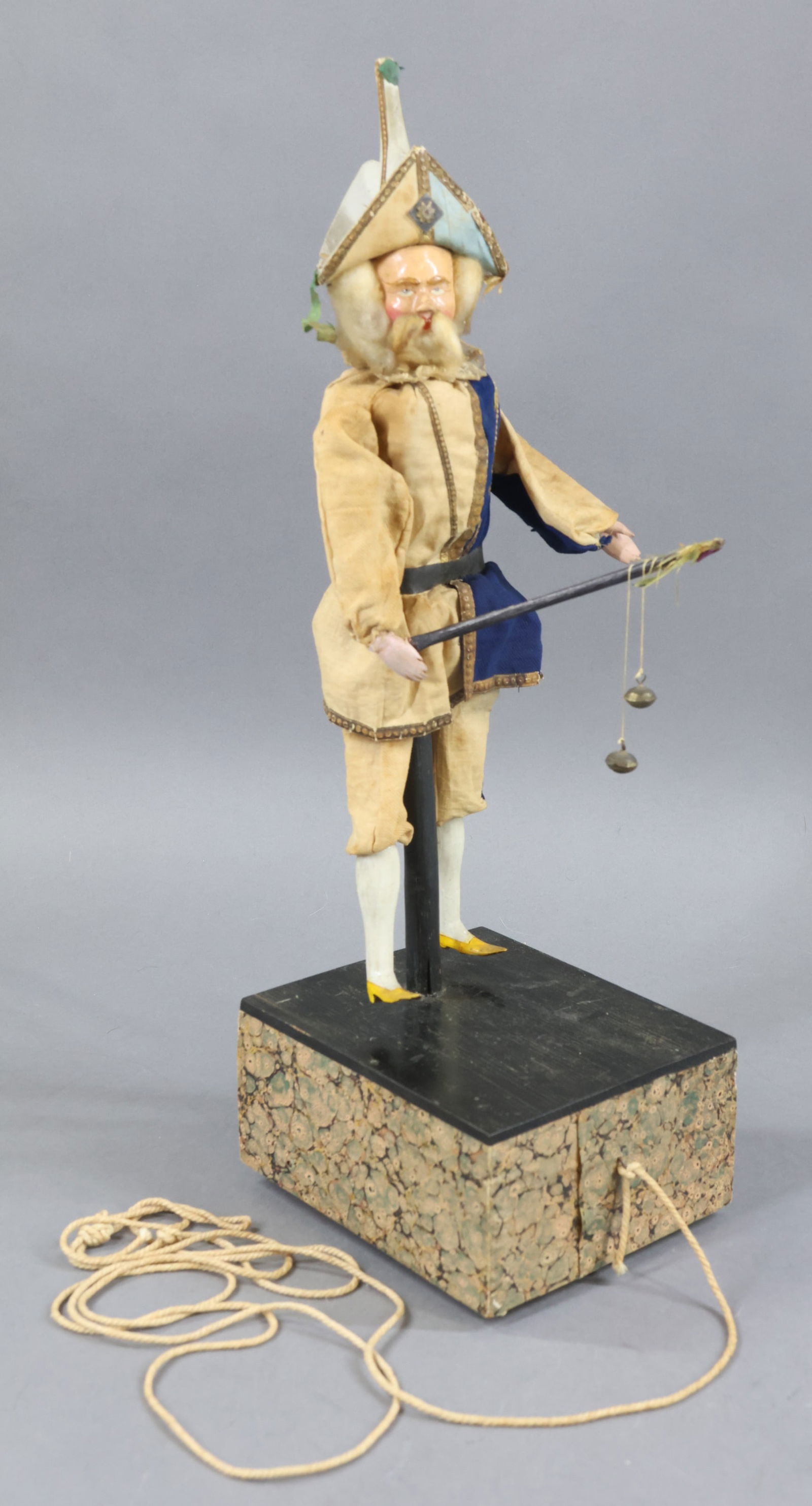 TOYS - ANTIQUE.: 16 1/2" German Ca. 1860 "Court Jester" Pull Toy. Papier mache head with prominent nose, painted features. Cotton batting hair, beard. Part of upper torso is wood, as well as arms and legs. Dressed in